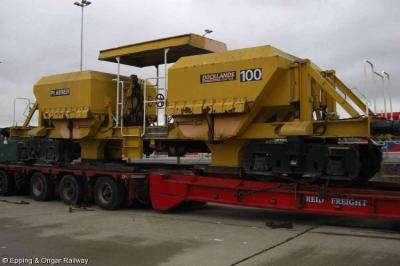 image showing a large yellow on-track machine