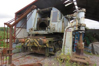 image showing a large yellow on-track machine