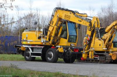 image showing a large yellow on-track machine