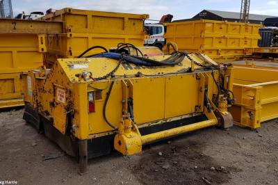 image showing a large yellow on-track machine