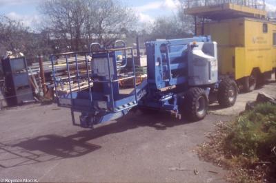 image showing a large yellow on-track machine