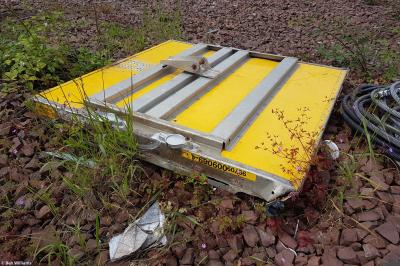 image showing a large yellow on-track machine