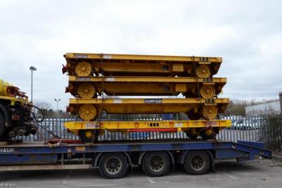 image showing a large yellow on-track machine
