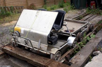 image showing a large yellow on-track machine
