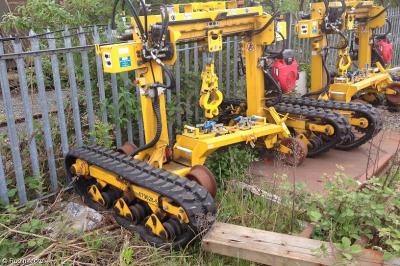 image showing a large yellow on-track machine