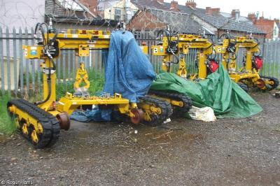 image showing a large yellow on-track machine