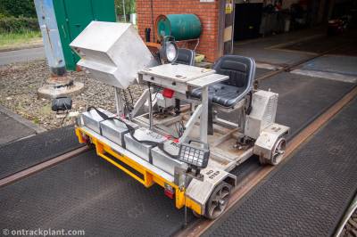image showing a large yellow on-track machine