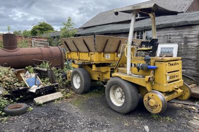 image showing a large yellow on-track machine