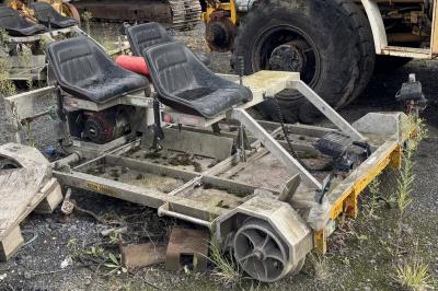 image showing a large yellow on-track machine