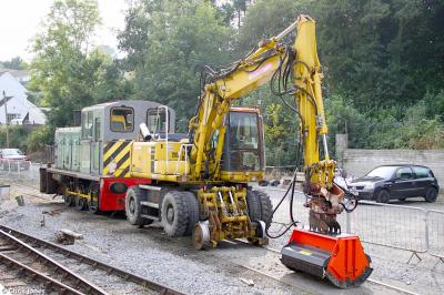 image showing a large yellow on-track machine