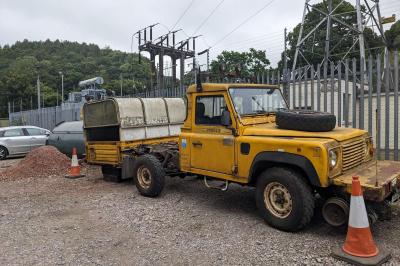image showing a large yellow on-track machine