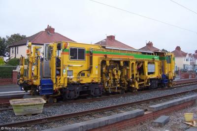 image showing a large yellow on-track machine