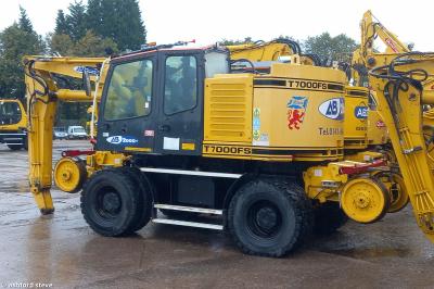 image showing a large yellow on-track machine