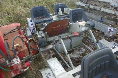 image showing a large yellow on-track machine