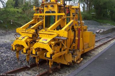 image showing a large yellow on-track machine