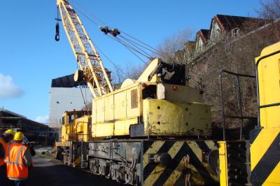 image showing a large yellow on-track machine