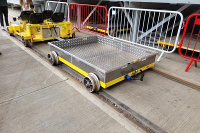 image showing a large yellow on-track machine