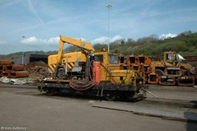 image showing a large yellow on-track machine