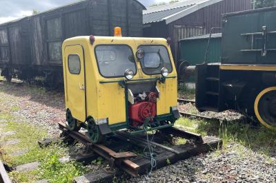 image showing a large yellow on-track machine