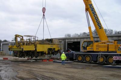 image showing a large yellow on-track machine