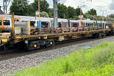 image showing a large yellow on-track machine