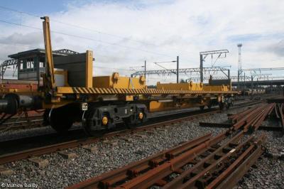 image showing a large yellow on-track machine