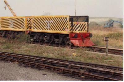 image showing a large yellow on-track machine
