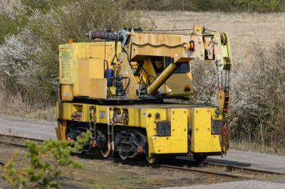 image showing a large yellow on-track machine