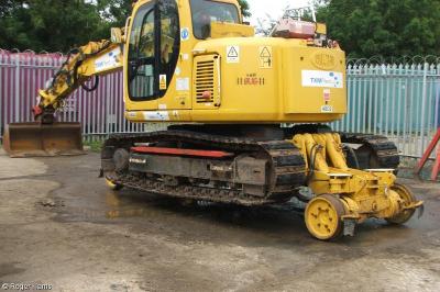 image showing a large yellow on-track machine