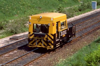 image showing a large yellow on-track machine