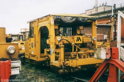 image showing a large yellow on-track machine