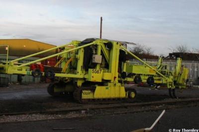 image showing a large yellow on-track machine