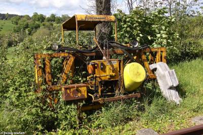 image showing a large yellow on-track machine