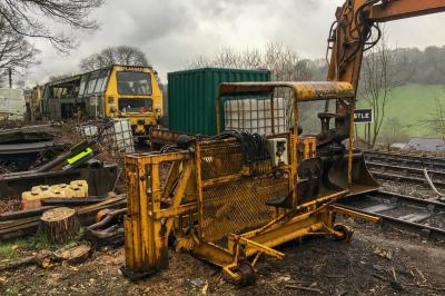 image showing a large yellow on-track machine