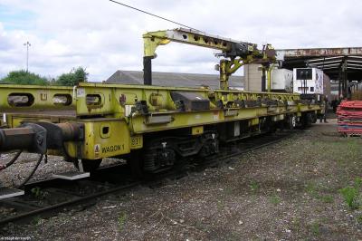 image showing a large yellow on-track machine