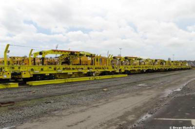 image showing a large yellow on-track machine