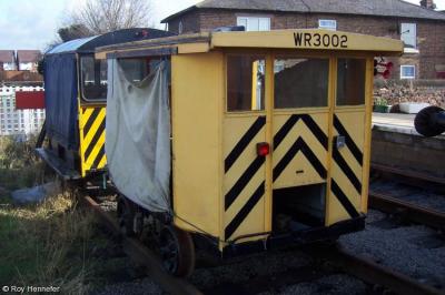 image showing a large yellow on-track machine