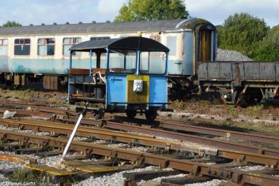 image showing a large yellow on-track machine