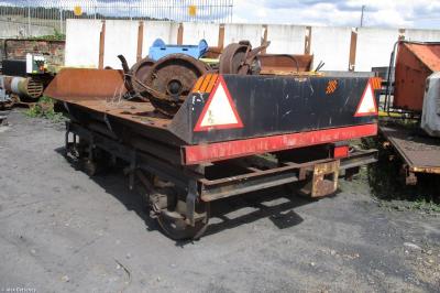 image showing a large yellow on-track machine