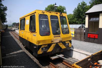 image showing a large yellow on-track machine