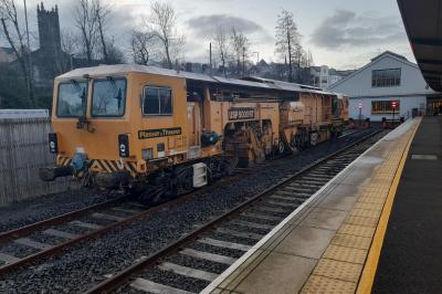 image showing a large yellow on-track machine