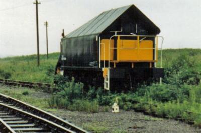image showing a large yellow on-track machine