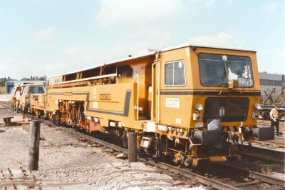 image showing a large yellow on-track machine