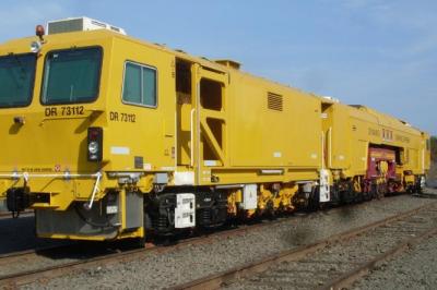 image showing a large yellow on-track machine