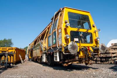 image showing a large yellow on-track machine