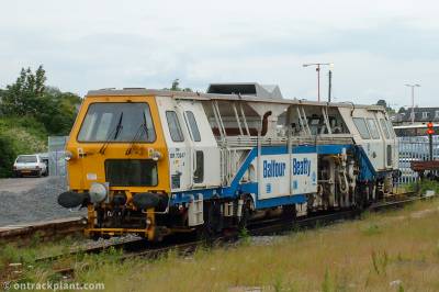 image showing a large yellow on-track machine