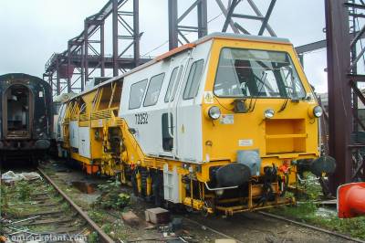 image showing a large yellow on-track machine
