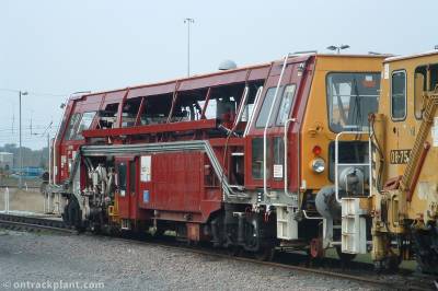 image showing a large yellow on-track machine