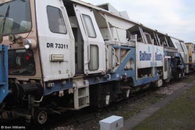 image showing a large yellow on-track machine