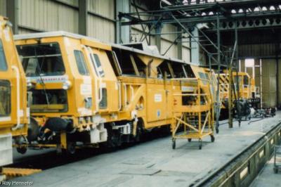 image showing a large yellow on-track machine